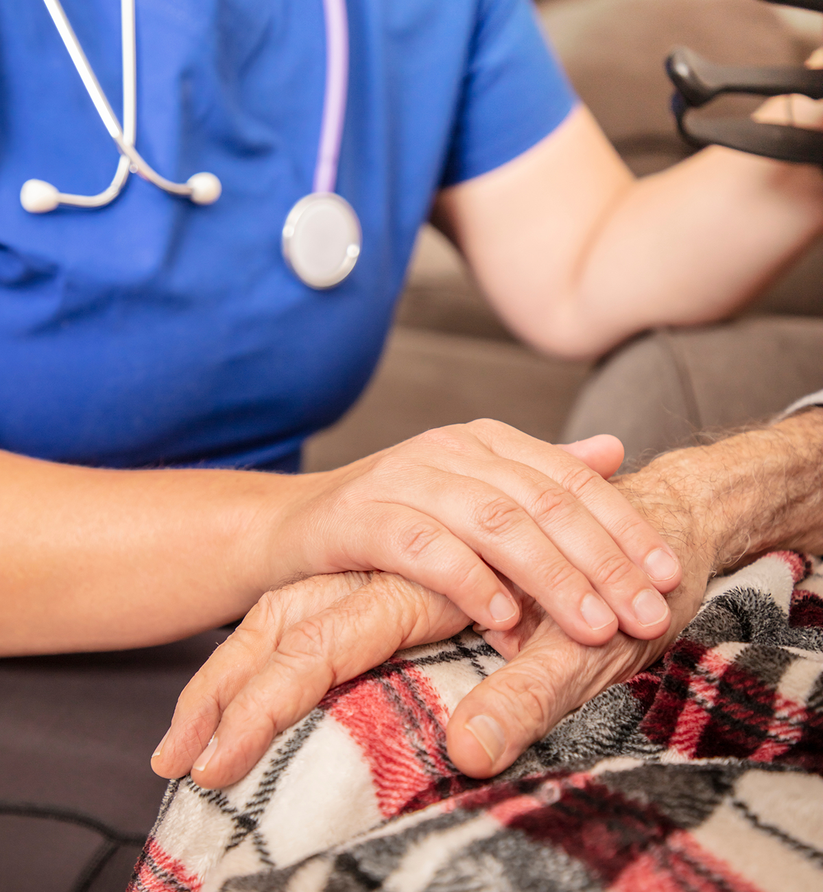 image of physical therapist touching patient's hand